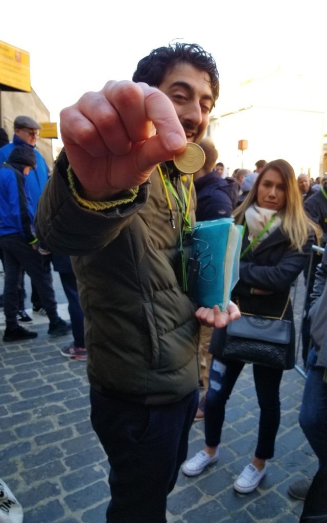 Jad holding Vatican coin