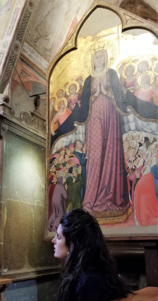 Woman near art in Duomo chapel